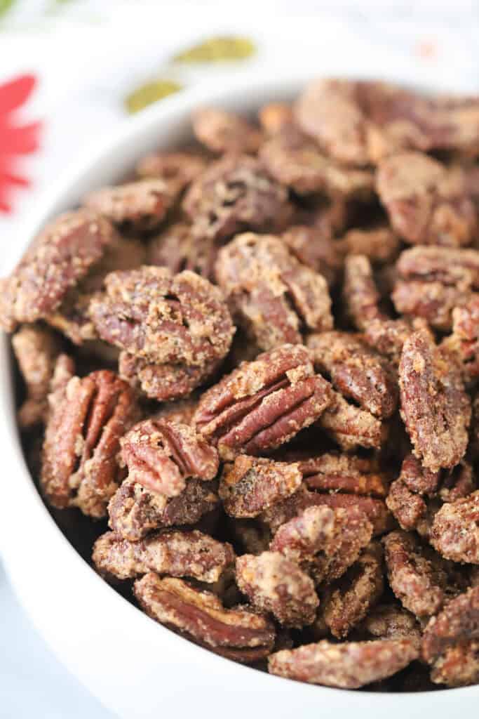 A bowl full of candied pecans.
