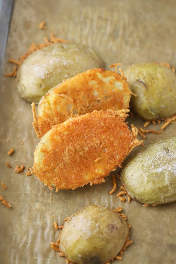A baking sheet with Parmesan cheese crusted potatoes.