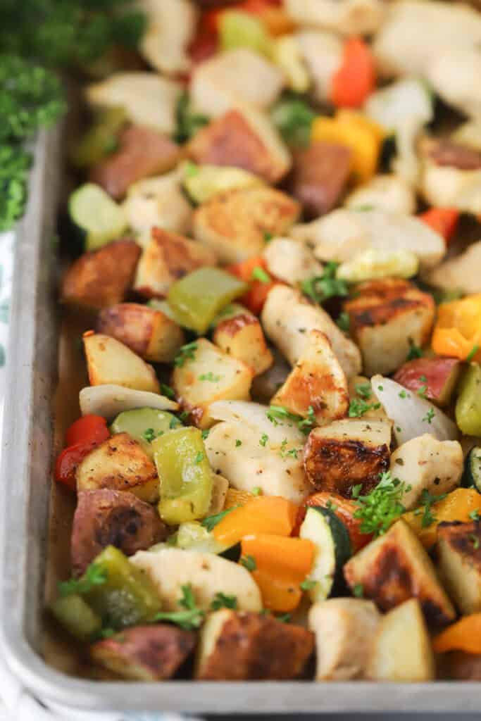 Chicken and veggies on a sheet pan.