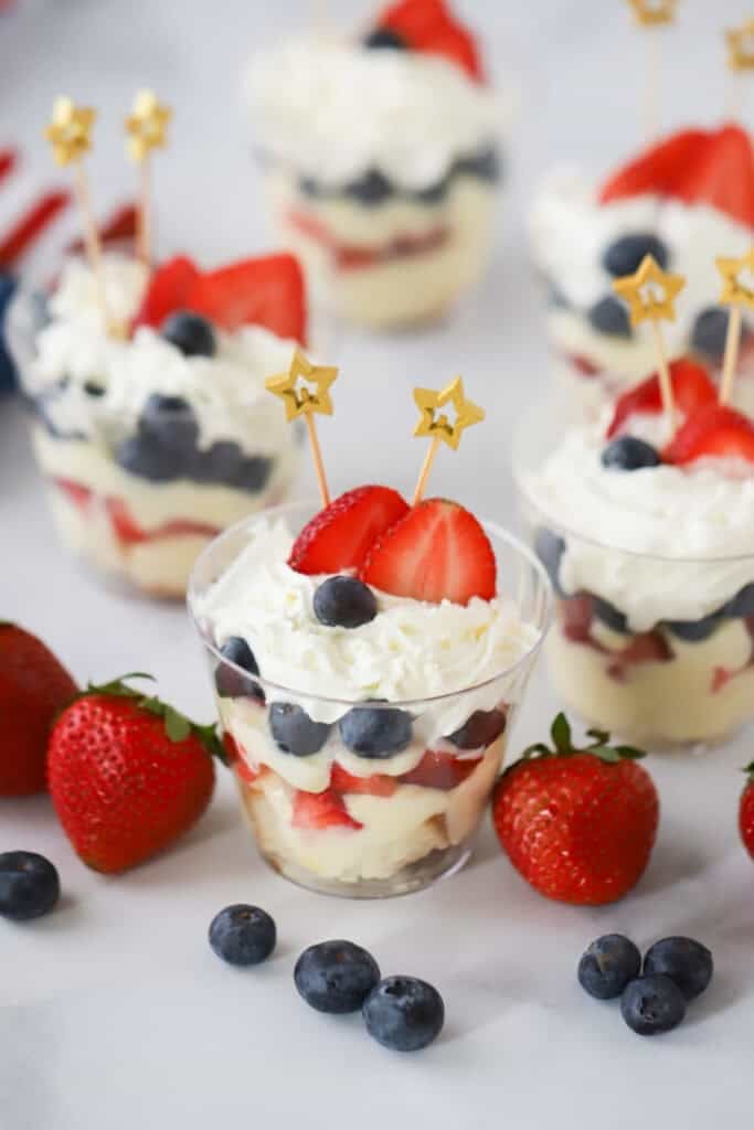 Berry Parfaits in individual plastic cups, garnished with little star-shaped toothpicks for the 4th of july.