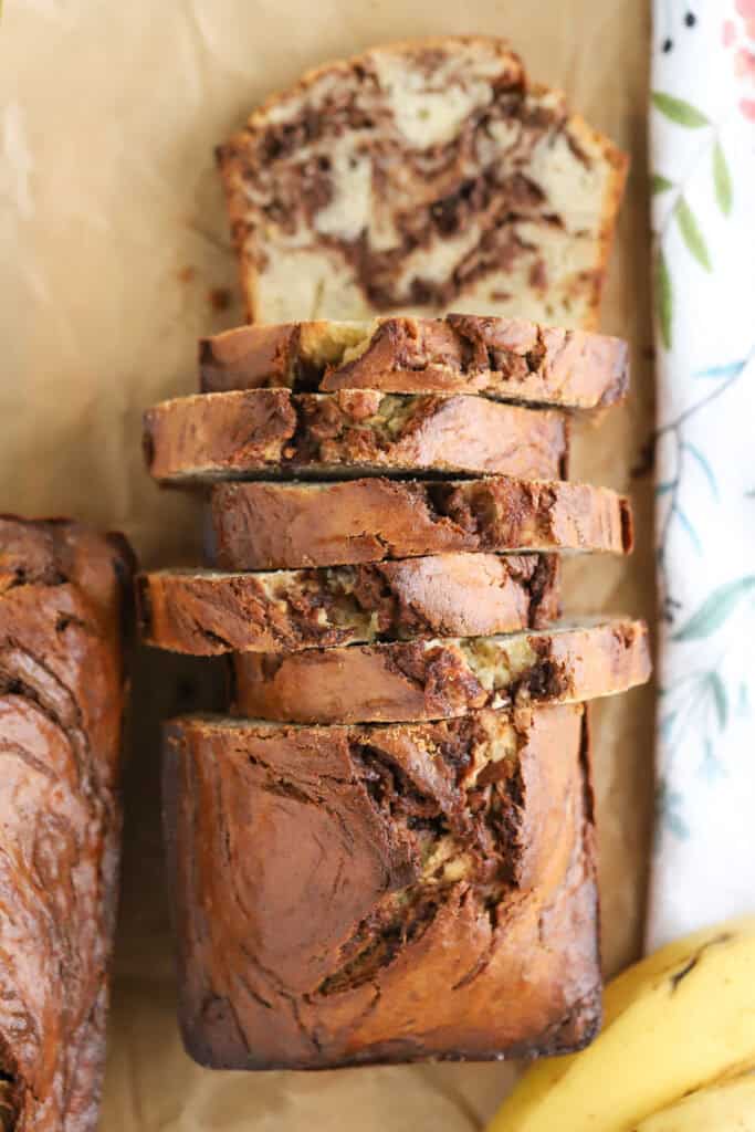 A sliced loaf of banana nutella bread.