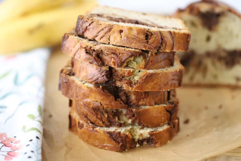 Slices of Nutella banana bread on a cutting board.